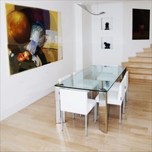 Glass table and chairs in dining room