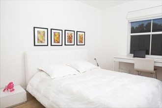 Bed and wall art in modern bedroom