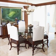 Table and chairs in ornate dining room