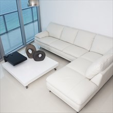 High angle view of sofa and coffee table in modern living room