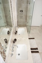 High angle view of sinks and shower in modern bathroom