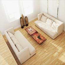 High angle view of sofas and coffee table in modern living room