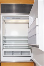Close up of empty open refrigerator