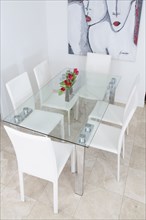High angle view of table and chairs in modern dining room