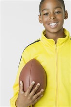African boy holding football