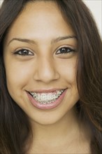 Hispanic girl wearing braces