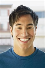 Close up of Asian man smiling