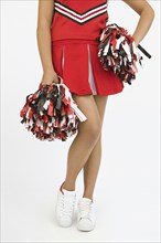Asian girl in cheerleading outfit
