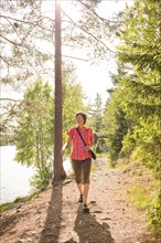 Caucasian woman hiking near river