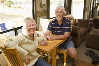 Senior Caucasian couple sitting in motor home