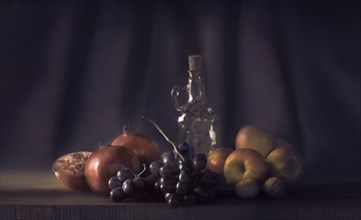 Fruit and bottle on table