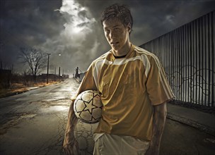 Illustration of soccer player holding ball on city street