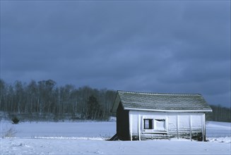 House in snowy rural landscape