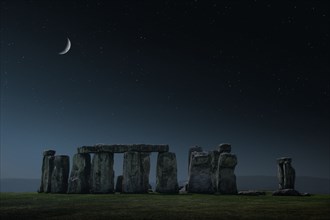 Crescent moon over Stonehenge monument