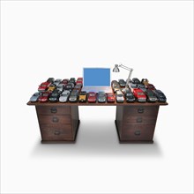 Desk with laptop and model cars