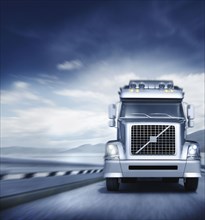 Blurred view of semi-truck driving on freeway