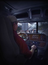 Trucker driving on freeway