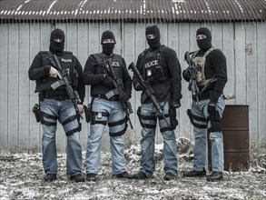 Police snipers standing together outdoors