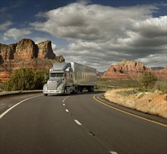 Semi truck driving through desert