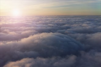 High angle view of sky above clouds