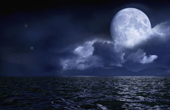 Full moon over seascape and horizon