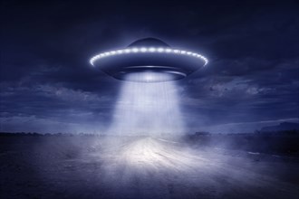 Alien spaceship landing on rural road