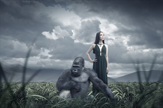 Woman and gorilla in remote field