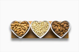 Heart-shaped bowls of heart-healthy nuts