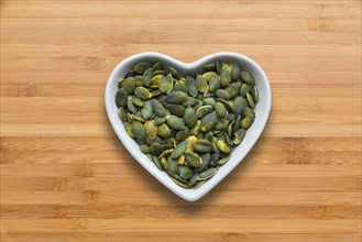 Heart-shaped bowls of heart-healthy seeds