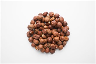 Pile of hazelnuts in shape of a circle