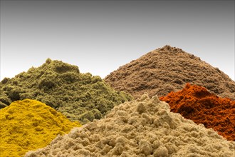 Multicolor piles of powder