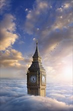Birds flying around clock tower above clouds