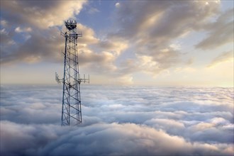 Cellular tower above clouds