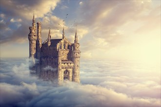 Birds flying around castle above clouds