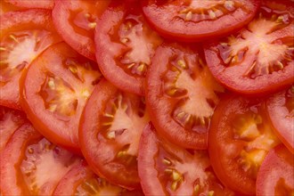Pile of sliced red tomatoes