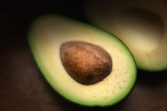 Pit in sliced avocado