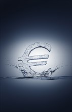 Water droplets splashing from ice euro symbol