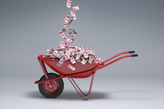 Yuan cash falling into red wheelbarrow