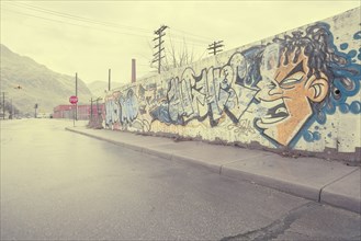 Graffiti wall near wet street
