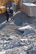 manager and worker in marble quarry