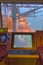 radar screen on bridge of container ship