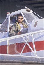 Pilot Sitting in a Cockpit of a Private Plane