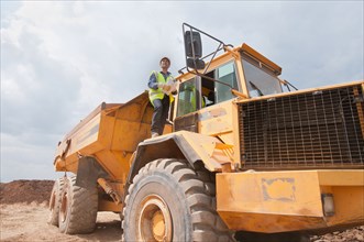 Engineer on dump truck in construction site