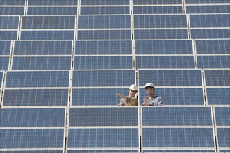 two engineers in solar power plant