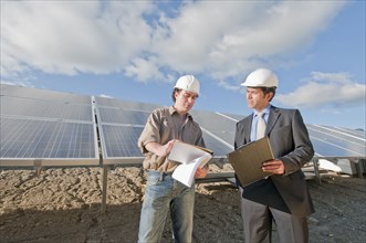 engineer and businessman in solar plant
