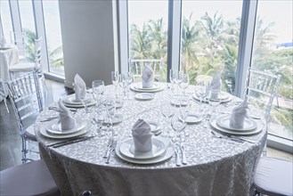 Set table at window in restaurant