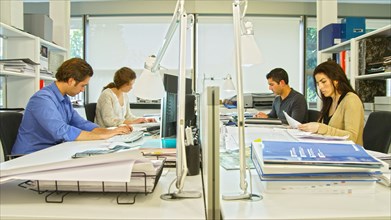 Business people working at desk in office