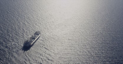 Aerial view of shipping barge in ocean
