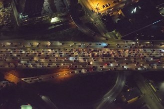 Aerial view of urban highway lit up at night