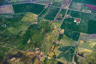 Aerial view of green farmland plots